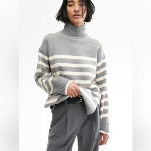 H & M oversized striped sweater. Has a super cute v detailed on the neck. Large.